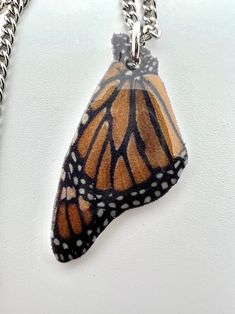 "Replica of a monarch butterfly wing. This is a lightweight pendant made to look like a monarch butterfly wing. It is from a photo of one of the many monarchs I have raised and released. It comes on a 20\" silver colored chain or black cord with a clasp." Wing It, Butterfly Pendant Necklace, Butterfly Wing, Monarch Butterfly, Butterfly Pendant, Butterfly Wings, Pendant Necklaces, Necklace Etsy, Jewelry Necklace Pendant