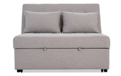 a gray couch with two pillows on it and some black legs, sitting in front of a white background