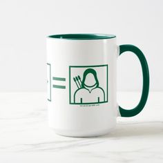 a green and white coffee mug with an image of a person holding a fork in it