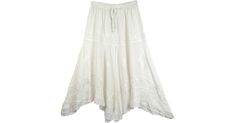 Snow White Boho Chic Skirt - A very classy rodeo skirt in an all year around popular color. This unique and elegant masterpiece skirt with a handkerchief bottom is made of 100% rayon. This skirt is stitched in layers that become fuller with each tier, each tier has an individual embroidered design with a ruffled handkerchief bottom. This skirt is full and flowing with an elastic waist and drawstring. This stylish skirt can be worn in summer with flip flops and a camisole or with leggings and boo Embroidered Cream Skirt For Summer, Summer Cream Embroidered Skirt, White Bohemian Lined Maxi Skirt, Bohemian White Lined Maxi Skirt, White Flowy Bohemian Maxi Skirt, White Bohemian Flowy Maxi Skirt, Elegant White Embroidered Skirt, Bohemian White Flowy Maxi Skirt, Elegant White Beach Skirt