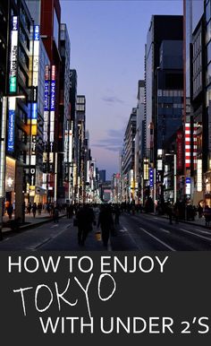 an advertisement for tokyo with people walking down the street at night in front of tall buildings