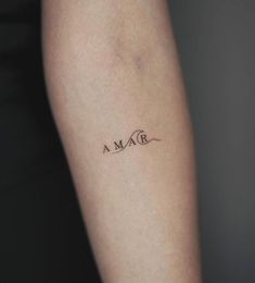 a woman's arm with a tattoo that reads, amo on the side