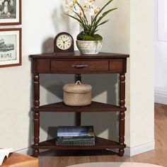 a corner table with a clock and flowers on it