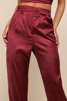 Even once all the holiday festivities are over, the Lulus Flawless Behavior Burgundy High Rise Straight Leg Pants are a chic look that can be styled over and over again! Sleek woven satin shapes these trendy pants that have a high-rise fit with a banded waist, belt loops, and a top clasp closure above a hidden zip fly. The straight pant legs feature pleated accents, diagonal front pockets, and full-length hems. Fit: This garment fits true to size. Length: Floor length. Size medium Inseam: 30.50 Red Satin Bottoms For Summer, Red Satin Summer Bottoms, Elegant Red Satin Bottoms, Red Satin Bottoms, Chic Satin Tapered Leg Pants, Red Satin Party Bottoms, Satin Bottoms For Summer Date Night, Satin Bottoms For Date Night In Summer, Chic Satin Ankle-length Bottoms