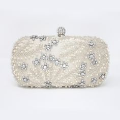 New to our Millennium collection, This beautiful romantic Beige crystal leaves embroidered and beads bridal clutch bag is made of very fine quality of crystal, beads rhinestones, fabric and metal and it comes with two chains, one chains length is 15 inches for a shoulder bad 46 inches long os cross body bag Detachable chain for your Big day! ► ABOUT YOUR ORDER * All items are neatly packaged in our beautiful jewelry boxes and elegant organza bags. * All items are 100% gift-ready. * Each order comes with a personalized handwritten card and a branded Millennium Bride jewelry cloth. * Each order comes with a free gift. ► PERSONALIZTION * If your order is a gift, you may contact us with the recipient's name or a message, and we'll print a personalized card that will be elegantly packaged with Rectangular Embroidered Evening Bag For Wedding, Embellished Clutch Evening Bag For Reception, Rectangular Clutch With Pearl Embroidery For Reception, Beaded Rectangular Bag For Reception, Rectangular Beaded Bag For Reception, Elegant Clutch With Pearl Embroidery For Reception, Embellished Rectangular Evening Bag For Reception, Elegant Beaded Clutch For Reception, Rectangular Embellished Evening Bag For Reception