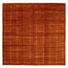 an orange and brown rug with squares on the bottom, in various sizes and colors