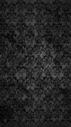 black and white wallpaper with an ornate design on the bottom right corner, in shades of gray