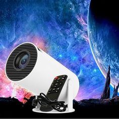 a white projector sitting on top of a table in front of a space background