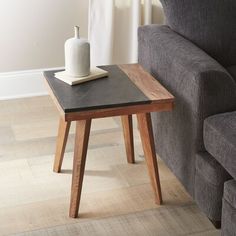 a living room with a couch, chair and end table