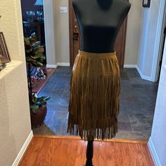 This Western Fringed Skirt By Back In The Saddle Is Perfect For The Rodeo And Stock Show. Pair With A Pair Of Western Boots And You’re Ready To Go. Size Medium. 3 Rows Of Fringe. Elastic Waist. Brown Party Bottoms With Flowy Fit, Fitted Brown Tiered Mini Skirt, Fall Bohemian Brown Skirt, Bohemian Brown Skirt For Fall, Bohemian Brown Bottoms With Fringe, Bohemian Brown Fringe Bottoms, Fitted Bohemian Brown Mini Skirt, Fitted Brown Tiered Skirt, Brown Pencil Skirt For Fall Party