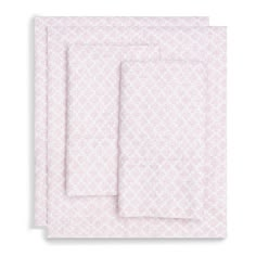 two sheets with pink and white designs on the front, one is folded in half