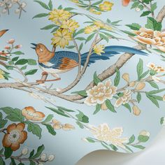 a wallpaper with flowers and birds painted on it's sides, along with leaves and branches