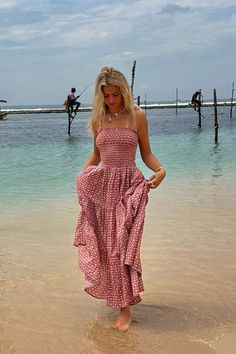 This ultra pretty Orla maxi dress is a definite holiday essential. Very flattering and the perfect combination of floaty and chic. It is a super pretty purple block print motif on a subtle and soft pinky orange base. Dress it down with flip flops or trainers and boho accessories or glam it up with chic sandal and a panama hat. Looks perfect with a little denim jacket for cooler evenings. This dress has a ruched bust, a tiered skirt, shoulder ties and has those all important pockets of course. Made from pure cotton voile you can feel good about wearing it as well as looking great! Our model felt so good in this and looked so pretty wearing it that we renamed it the Orla in her honour.  Our model is a size UK10 and this dress is One Size only which fits a UK 8 - 14. Summer Dress Boho, Pinky Orange, Maxi Summer Dress, Print Summer Dress, Boho Beach Dress, Maxi Dress For Women, Cotton Long Dress, Chic Sandals, Printed Summer Dresses