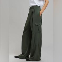 The Elm Wide Cargo Pants In Olive From Frankie Shop Blend Functionality With Style. Featuring A High-Rise Waist And Wide-Leg Silhouette, These Pants Offer A Contemporary Twist On Classic Cargo Pants With Their Utility Pockets And Relaxed Fit. Ideal For Both Day And Night, Pair Them With A Simple Tee For A Causal Look Or Dress Them Up With A Blouse And Heels. Never Worn As They Are So Long Wide Cargo Pants, Shop Pants, The Frankie Shop, Elastic Shorts, Frankie Shop, Long Maxi Skirts, Simple Tees, Flare Leg Pants, Midi Length Skirts