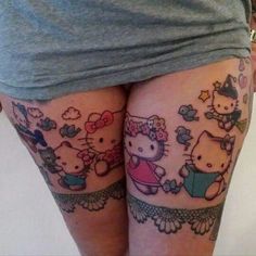 a woman with hello kitty tattoos on her legs