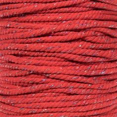 red yarn with silver speckles on it