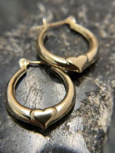 10K Vintage hollow hoop earrings with heart detail. These are so cute!  They would be great alone or stacked.  Hallmarked 417 for 10K gold.  They measure 3/4 inches tall and wide.  Weight 1.49 grams Yellow gold. Newnan Ga, Heart Hoop Earrings, Gold Heart, Jewelry Earrings Hoops, Heart Of Gold, 10k Gold, Etsy Earrings, Hoop Earrings, Jewelry Earrings