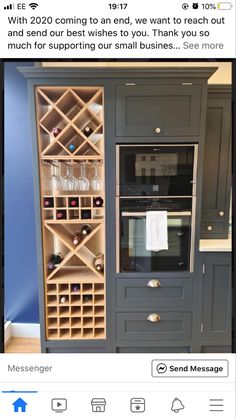 a wine rack in the middle of a kitchen