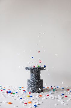 an object is surrounded by confetti on the floor