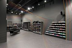 an empty shoe store with lots of shoes on shelves