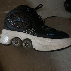 a pair of roller skates sitting on the ground