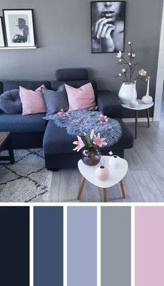 a living room with grey walls and pink pillows on the couch, white coffee table