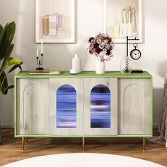 a green and white sideboard in a living room