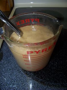 a blender filled with liquid sitting on top of a counter