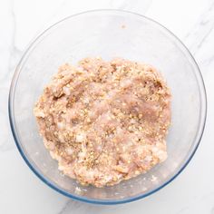 a glass bowl filled with food on top of a white counter