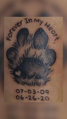 an inked photo of a dog paw with the words forever in my heart written on it