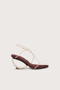 A sandal with stamped leather straps that match the sculptural, rounded heel. — Rubber sole — Adjustable buckle on ankle strap — Stamped leather heel and straps — Cushioned base — 3.25" heel height Luna Sandals, Fancy Heels, Unique Heels, Embroidered Flats, Clear Shoes, Stamped Leather, Luxury Designer Shoes, Classy Shoes, Swimming Bag