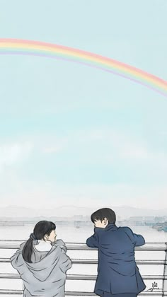 two people are standing on a bridge looking at the sky with a rainbow in the background