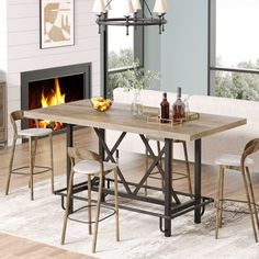 a dining room table with four chairs and a fire place in the fireplace behind it