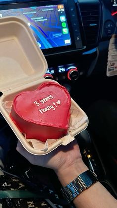 a heart shaped cake in a foam container with the words happy valentine's day written on it