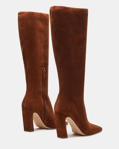 Expertly constructed, the LIZETTE boot is designed with a sleek knee-high silhouette, square toe, and stylish heel. This boot is durable and fashionable, making it the perfect addition to any wardrobe. Elevate your look with these timeless boots. 3.5 inch heel height Size 6 measurements: 14.5 inch shaft circumference, 14 inch shaft height Size 8 measurements: 16 inch shaft circumference, 14.5 inch shaft height Size 10 measurements: 16.75 inch shaft circumference, 15 inch shaft height Textile and Tall Platform Boots For Fall, Elegant Tall Knee-high Winter Boots, Elegant Tall Boots For Fall, Classic Square Toe Knee-high Boots For Fall, Formal Knee-high Boots For Fall, Formal Fall Knee-high Boots, Elegant Tall Mid-calf Boots For Fall, Elegant Tall Brown Boots, Brown Tall Boots Medium Width