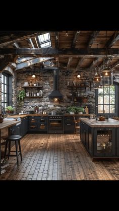 a large kitchen with wooden floors and exposed ceilings