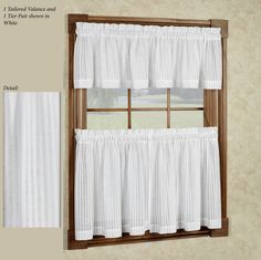 a window with two white valances hanging from it's side and the words show in