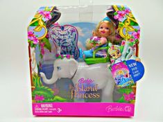 the barbie doll is riding on an elephant