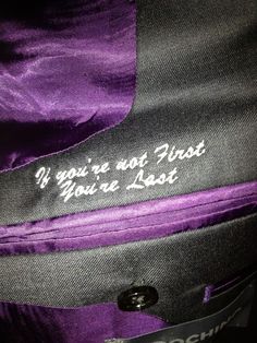 a purple and black bag with the words if you're not proud, you're lost on it