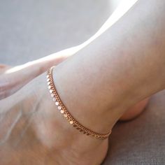 Minimalistic 24K Gold-Filled Coin Anklet  Add a touch of understated elegance to your style with this minimalistic coin anklet, crafted in 24K gold-filled brass. The dainty design features a subtle row of polished coin accents, making it a timeless piece that pairs effortlessly with any outfit, from casual wear to sophisticated ensembles.  Whether worn solo for a sleek, modern statement or layered with other ankle accessories, this piece is the epitome of refined simplicity, making it a must-hav Ankle Accessories, Coin Anklet, Stocking Fillers For Her, Forever Jewelry, Jewelry Ring Box, Mens Jewelry Bracelet, Fine Earrings, Understated Elegance, Gifts For Mum