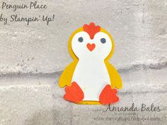 the penguin place by stampin'up has been designed to look like it is holding a heart