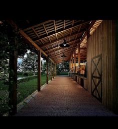 a covered walkway leading to a wooden building