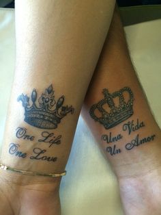 two people with matching tattoos on their legs, one has a crown and the other has an inscription