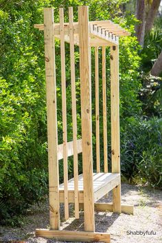 a wooden bench sitting in the middle of a garden next to bushes and trees with text overlay that reads, how to build a wood bench