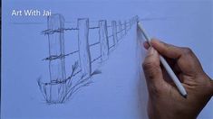 someone is drawing a fence with a pencil