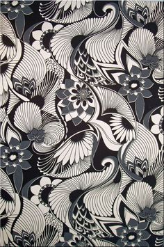 a black and white pattern with flowers on it