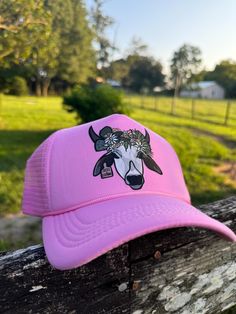 Floral Florida Brahman high crown trucker cap  My name is Hailey. I am a third-generation cattlewoman from central Florida! I created this page to share the pictures I capture while working cattle and every day on the ranch. I am incredibly passionate about the Florida cattle industry and want to share it with everyone! Here's a view of Florida ranch life through my lens! ||SOCIAL MEDIA || Follow all my social media accounts!  Facebook and Instagram: @ranchrevivalphotography Tiktok: @haileytomkow Don't forget to tag me!! Elevate your Western style with this classic Otto trucker hat, designed for those who appreciate both comfort and fashion. Crafted with a breathable mesh back and a sturdy, curved brim, this hat is perfect for long days under the sun. The adjustable snapback closure ensure Country Style Adjustable Trucker Hat For Spring, Adjustable Country Style Trucker Hat For Spring, Spring Brimmed Trucker Hat, Spring Trucker Cap, Country Style Trucker Hat For Spring, Spring Western Trucker Hat, Spring Trucker Hat For Country Events, Fun Trucker Hat For Country Events, Pink Snapback Hat For Spring