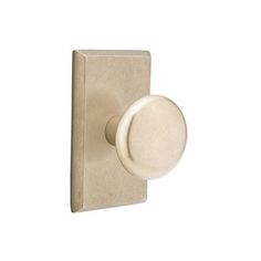 a white door handle with a round knob