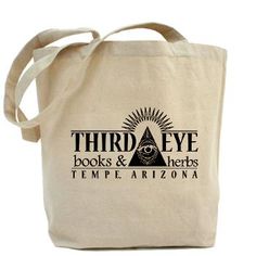 a tote bag with the words third eye books and herbs in black on it