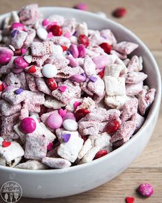 a white bowl filled with valentine's day puppy chow